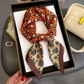Leopard and floral print silk scarf displayed in a premium black gift box for women - 70x70cm / Orange