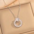 Close-up of heart-shaped zircon pendant necklace set in a beige jewelry box - 437 Silver Plated Necklace