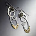 Irregular hollow spiral earrings with pear-cut dark gemstones and gold-tone accents - Spiral Hollow Black Gemstone Earrings