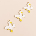 Detail of funny white duck alloy charms with golden outlines and yellow accents - Funny Middle Finger Duck Style / White