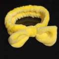 Soft yellow plush headband with twisted knot bow design for facial cleansing and hair styling - Plush Bow Hairband / Yellow