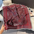 Detailed shot of burgundy paisley silk scarf on plush mat with elegant accessories - 70*70cm / Wine Red Striped Paisley