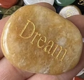 Polished yellow topaz inspirational stone with gold Dream engraving held in hand - Yellow Stone