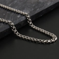 Polished silver stainless steel Cuban link necklace for men and women on marble background - 7mm * 45cm