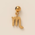 Macro detail of Scorpio zodiac pendant in gold finish with a matte frosted texture - Frosted Scorpio Zodiac Sign