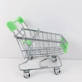 Miniature metal shopping cart for kids with green plastic parts on white background - Green