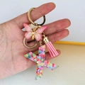 Detail of resin letter X keychain with pink butterfly, tassel, and colorful heart sequins - Butterfly Tassel 8-Shape Buckle / Letter X