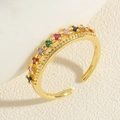 Macro shot of double-layer gold ring with colorful zircon stones in rainbow palette - Double Layer Colored Zirconia - Gold