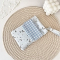 Macro detail of blue floral multi-purpose nurse pen pocket on a woven mat - Twill Floral Blue