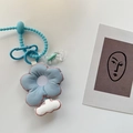 Detailed shot of light blue embroidered flower keychain with cloud charm and spring lanyard - Light Blue Floral