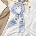 Light blue silk ribbon scarf with moon phase print and celestial patterns for ponytails - Blue Sun God
