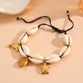 Detail of shell beaded bracelet with golden turtle and dolphin charms on woven cord - Black Rope Fish Bracelet