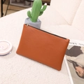 Slim lychee pattern PU leather makeup bag in caramel brown with a secure metal zipper - Tan