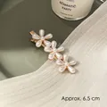 Elegant golden hair clip featuring three white pearl flowers in a 6.5 cm variant design - Three Pearl Flowers Long