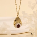 Detail view of the evil eye pendant necklace with realistic brown eye and gold frame - Brown Drop-C1