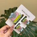Set of three acrylic hippo hair clips with blue bows displayed on a white jewelry card - Blue White Stripe Green Dress Hippo Clip 3PCS Set