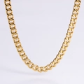 Macro detail of high-polish gold Cuban link chain showing flat links and smooth surface - 6.5mm Gold