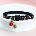 Cat collar with red, blue, and yellow woven texture, bell, and tassel charm details - Red Yellow Blue Weaving