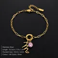 Gouden roestvrijstalen armband met letter M en roze kristal, 15+3cm verstelbaar. - Letter M