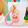 Detail of pink pearl duck keychain with woven strap and lucky coin pendant - Lucky Pink Rope + Pink Pearl Duck
