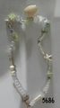 Ocean-style beaded necklace with white shells and green gravel stones on gray background - KC Gold Ocean (5686)