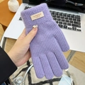 Detailed close-up of purple knit glove featuring fashion leather label and white flower ornament - Open Finger Candy Color Purple