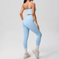 Detail of light blue yoga set with open back sports bra and high waisted leggings - Sky Blue