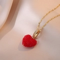 Macro detail of red heart pendant with gold bail and cubic zirconia on silk background - Red (X0422)