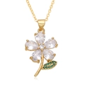 Nahaufnahme der goldenen Kette mit Zirkonia-Blütenanhänger und grünem Edelsteinblatt - Grünes Blatt Weißes Blumen-Stil (F219)