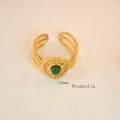 Detail view of gold ring with green stone, multi-layer hollow texture, 13mm width - African Jade