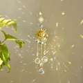 Golden suncatcher ornament featuring a metal sun face and multifaceted crystal spheres - Sun Charm / Gold
