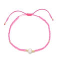 Detail of pink seed bead bracelet featuring a freshwater pearl and adjustable cord - Pink (QQ398A)