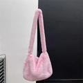 Close-up of pink faux rabbit fur texture and shoulder strap on a Y2K plush crossbody bag - Sakura Pink
