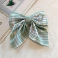 Green plaid fabric bow hair clip for women in a classic preppy style design - Cedar Green Plaid