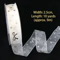 2.5cm white chiffon ribbon with gold star and bow prints for DIY gift wrapping - Gold Stamped Sheer Butterfly Star