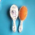 Spazzola per capelli per bambini con dinosauro glitterato e paillettes colorate arancio - Modello in Schiuma di Dinosauro con Aghi Gialli