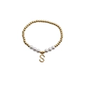 Gold beaded pearl bracelet with a colorful gemstone letter S charm on a white background - Letter S