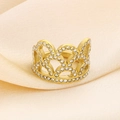 Close-up of golden crown ring with sparkling rhinestones on champagne satin background - Gold Crown Style (KR48511-GC)