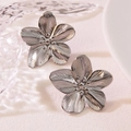 Elegant silver stainless steel flower stud earrings with detailed radial petal textures - Silver