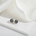 French vintage round marble pattern stud earrings with gold pins on white silk background - Black & White