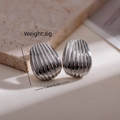Detailed view of oval metal earrings with vertical texture and silver polished finish - Silver Vertical Striped Shell