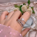Elegant adjustable pearl leaf ring with marquise zircon stones on a pink silk background - Pearl Leaf Style (305) / Adjustable Open