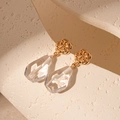 Macro shot of vintage gold rose stud earrings with a clear faceted teardrop pendant - Gold with Transparent Flower (Silver Pin)