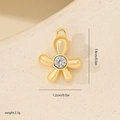 Macro detail of a gold flower pendant with cubic zirconia and exact size dimensions - Flower Style Gold (MYYX00671)