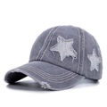 Detail of grey washed cotton baseball cap with distressed holes and sequin star patch - Gray