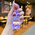 Close-up of purple acrylic liquid glitter keychain with cute bear hooded doll and bell - Luminous Bubble Bead Lilith / Purple