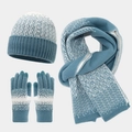 Close-up of knit winter set featuring snowflake patterns on hat, scarf, and gloves - Light Blue