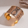 Detail showing the exotic snake pattern texture and polished gold interior of this wide cuff - Brown and Tan Snake Style / Gold