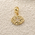 Detailed view of a gold star charm pendant with sparkling cubic zirconia and hammered texture - A0264