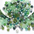 Macro shot of faceted green crystal glass beads for DIY jewelry and necklaces - Green System